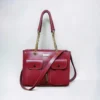 Red bucket bag with strap, great for everyday use.