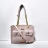 Pink bucket bag with strap, great for everyday use.